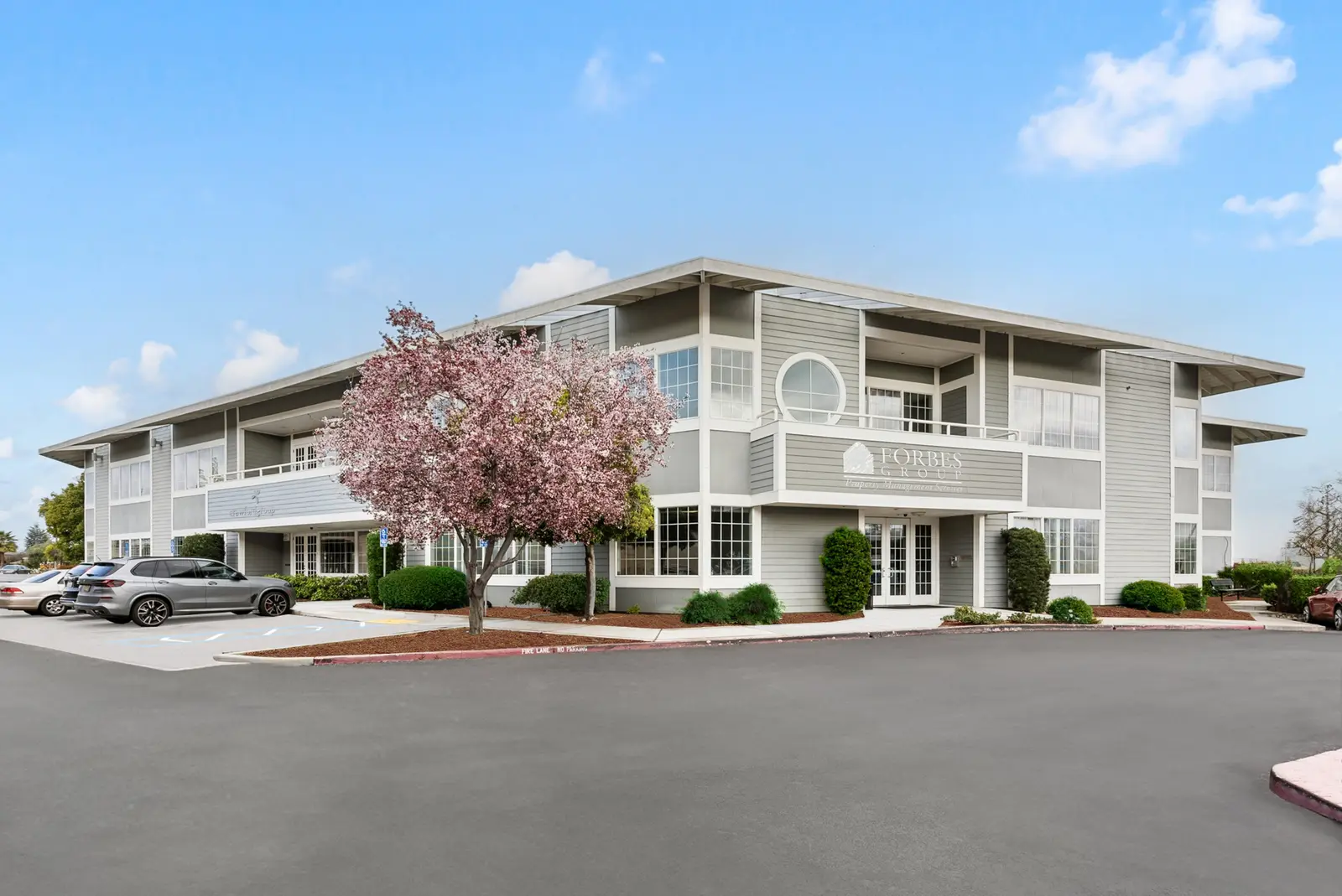 3190 S Bascom Ave in San Jose, a two-story office building behind a flowering tree